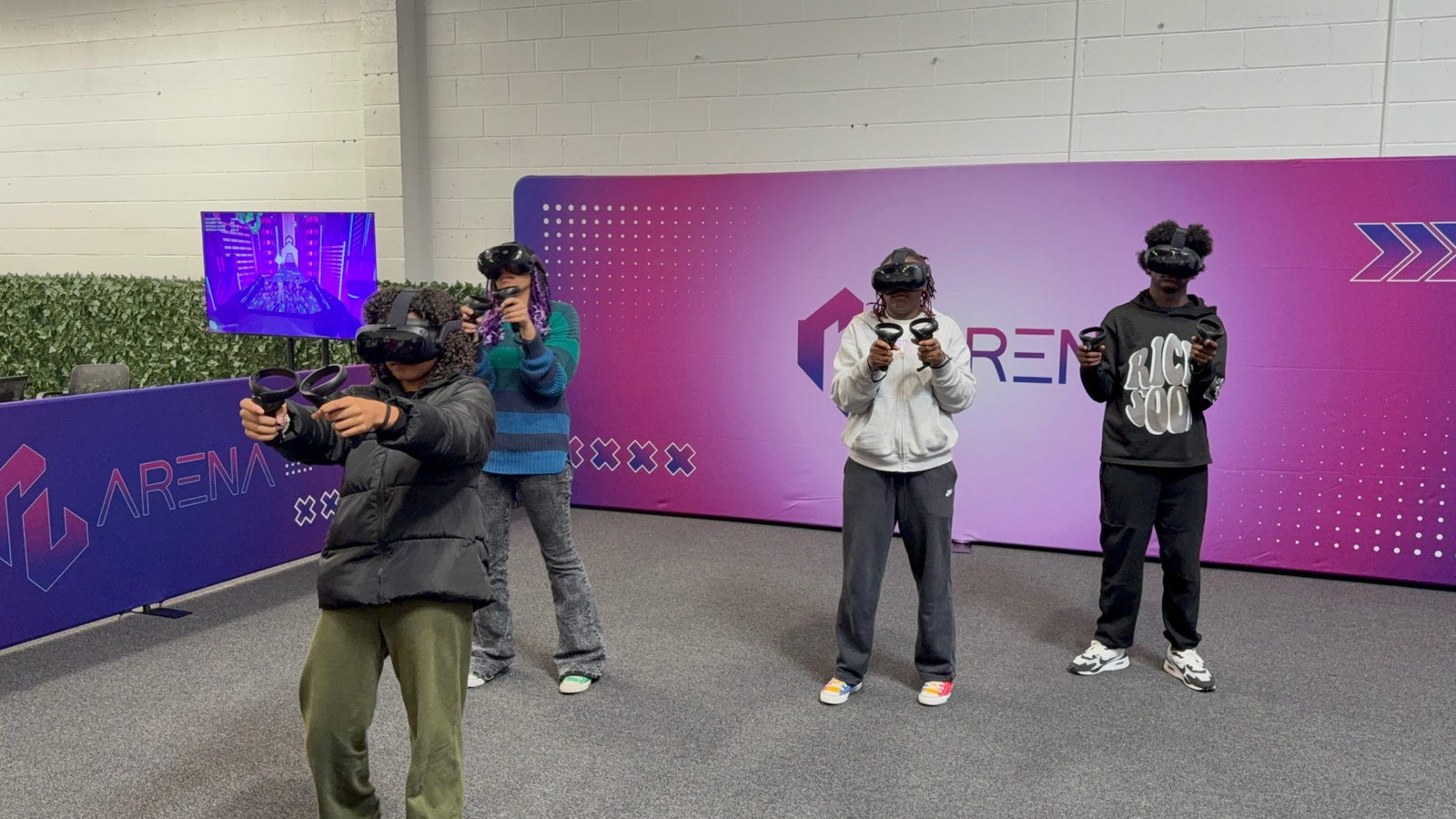 Four players geared up in the free roam arena