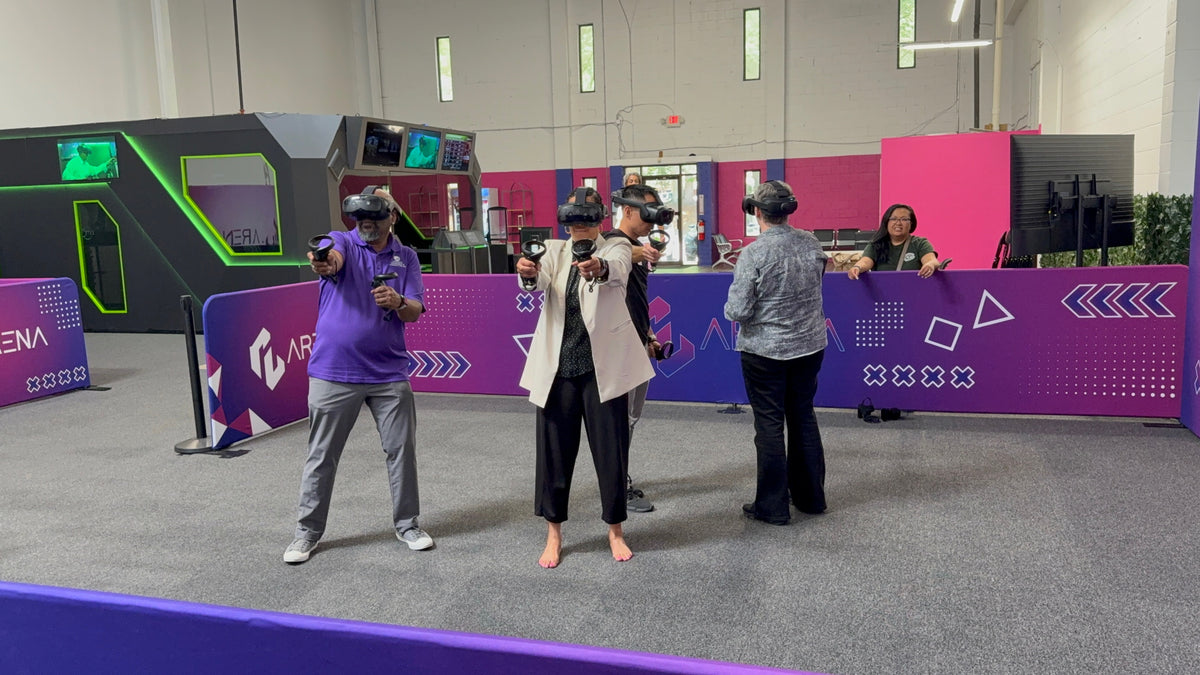 Squad of players in VR headsets spread across the Free Roam floor